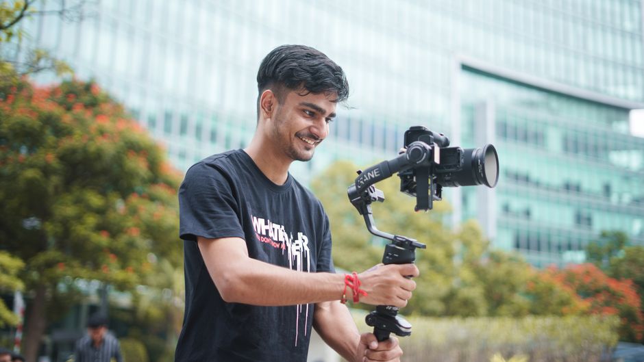 Smiling professional videographer at work